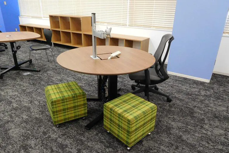 A round sit-stand table